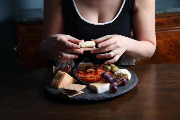 What do you eat with kimchi — kimchi on a cheese board with crackers, figs and grapes, handmade in North London