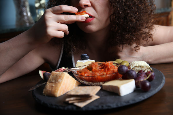 What do you eat with kimchi — kimchi on a cheese board with crackers, figs and grapes, handmade in North London